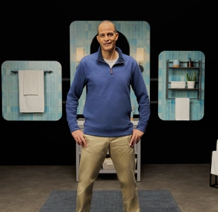 Ray standing in a bathroom, sharing about his vitiligo repigmentation with Opzelura.