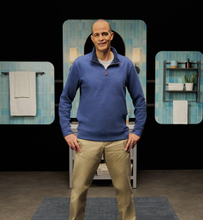 Ray standing in a bathroom, sharing about his vitiligo repigmentation with Opzelura.