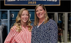 Anna and Rachael standing in front of an All-State Champions sign sharing their Moments of Clarity as they discuss managing eczema with Opzelura.