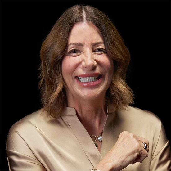 Vitiligo examples: A photo of a real patient smiling and showing off their skin after years of treatment for vitiligo with Opzelura.