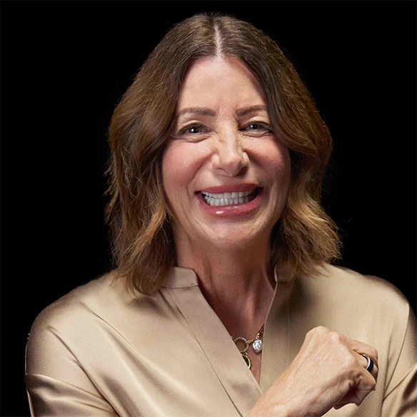 Vitiligo examples: A photo of a real patient smiling and showing off their skin after years of treatment for vitiligo with Opzelura.