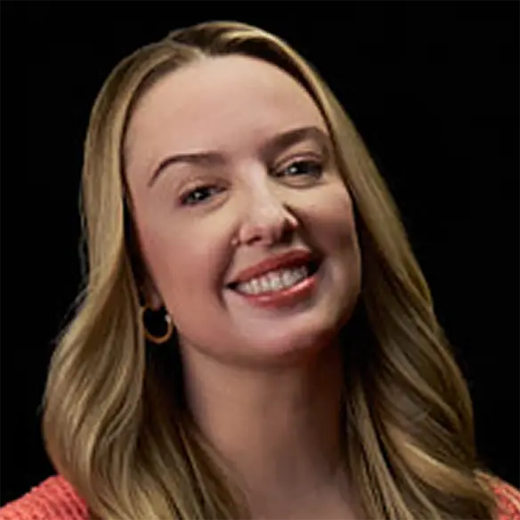 Vitiligo examples: A photo of a real patient smiling and showing off their skin after years of treatment for vitiligo with Opzelura.
