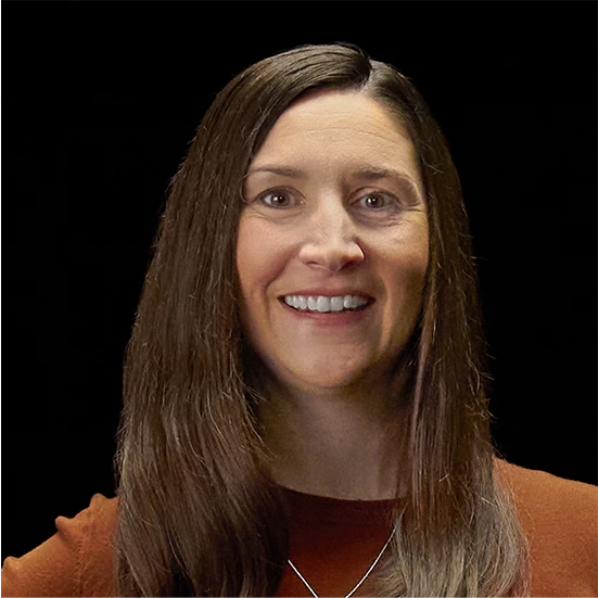 Vitiligo examples: A photo of a real patient smiling, one hand on their hip, and showing off their skin after treatment for vitiligo with Opzelura.