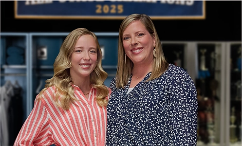 Anna and Rachael standing in front of an All-State Champions sign sharing their Moments of Clarity as they discuss managing eczema with Opzelura.